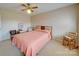 Cozy bedroom featuring a double bed, ceiling fan, and a small sitting area at 8510 Olive Branch Rd, Marshville, NC 28103