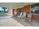 Covered back patio with comfortable seating area at 8510 Olive Branch Rd, Marshville, NC 28103