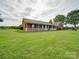 Brick ranch house with a covered porch and a spacious yard at 8510 Olive Branch Rd, Marshville, NC 28103