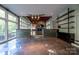 Open living area with a stone accent wall and hardwood floors at 501 Journey Sw St, Concord, NC 28025