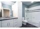 Clean bathroom with white cabinets, granite countertop, and a shower/tub combo at 501 Journey Sw St, Concord, NC 28025