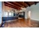 Modern kitchen with dark cabinetry, stainless steel appliances, and large island at 501 Journey Sw St, Concord, NC 28025