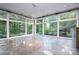 Sunroom with wall-to-wall windows and tiled floors at 501 Journey Sw St, Concord, NC 28025
