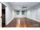 Spacious bedroom with hardwood floors, large windows, and a walk-in closet at 501 Journey Sw St, Concord, NC 28025