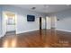 Bright bedroom with hardwood floors and ensuite bathroom at 501 Journey Sw St, Concord, NC 28025