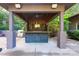 Covered outdoor kitchen with a large island and built-in grilling station at 501 Journey Sw St, Concord, NC 28025