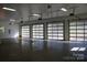 Four-car garage with frosted glass garage doors at 501 Journey Sw St, Concord, NC 28025