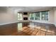 Spacious bedroom with hardwood floors and corner fireplace at 501 Journey Sw St, Concord, NC 28025