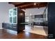 Modern kitchen with dark cabinetry and stainless steel appliances at 501 Journey Sw St, Concord, NC 28025