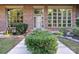 Brick front exterior with a light-colored door and landscaping at 501 Journey Sw St, Concord, NC 28025