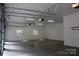 Large garage with high ceilings and multiple garage doors at 501 Journey Sw St, Concord, NC 28025