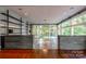 Spacious living room with hardwood floors and wall of windows at 501 Journey Sw St, Concord, NC 28025