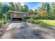 Brick ranch home with attached garage and landscaped yard at 501 Journey Sw St, Concord, NC 28025