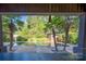 Relaxing pool with surrounding patio and tropical landscaping at 501 Journey Sw St, Concord, NC 28025