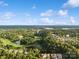 Aerial view of golf course, lake, and residential area at 607 Pine Links Dr, Tega Cay, SC 29708