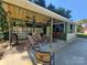 Relaxing outdoor bar area, complete with seating and ceiling fan at 4808 Asbury Dr, Monroe, NC 28110