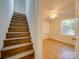 Wooden staircase leading to the upper level of the home at 3980 Fish Pond Rd, Salisbury, NC 28146