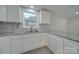 Kitchen with white cabinets and granite countertops at 3980 Fish Pond Rd, Salisbury, NC 28146