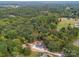 Aerial view of property showcasing expansive wooded area at 3980 Fish Pond Rd, Salisbury, NC 28146
