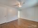 Bright bedroom with hardwood floors and ceiling fan at 3980 Fish Pond Rd, Salisbury, NC 28146