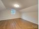 Bright bedroom with hardwood floors and a single window at 3980 Fish Pond Rd, Salisbury, NC 28146