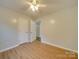 Light and airy bedroom with wood-look flooring and ample closet space at 3980 Fish Pond Rd, Salisbury, NC 28146