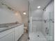 Elegant bathroom with double vanity, granite countertop and a large walk-in shower at 3980 Fish Pond Rd, Salisbury, NC 28146