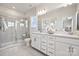 Double vanity bathroom with a large shower and modern finishes at 2050 Alexander Village Main Dr # 15, Charlotte, NC 28262