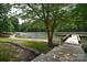 Peaceful lakeside dock with wooden walkway at 102 Elm St # 94, New London, NC 28127