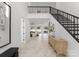 Elegant entryway, hardwood floors, and staircase at 5428 Carmel Rd, Charlotte, NC 28226