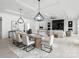 Open living room and dining area with modern decor, fireplace, and hardwood floors at 5428 Carmel Rd, Charlotte, NC 28226