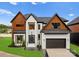 Modern two story home with stylish facade, attached garage, and manicured lawn at 5428 Carmel Rd, Charlotte, NC 28226
