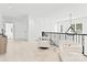 Bright hallway with modern light fixture and comfortable seating area at 5428 Carmel Rd, Charlotte, NC 28226