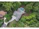 Aerial view of house with pool, showcasing backyard and driveway at 235 Grey Rd, Davidson, NC 28036