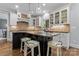 Modern kitchen with a large island, stainless steel appliances, and white cabinetry at 235 Grey Rd, Davidson, NC 28036