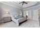 Spacious bedroom with large window, ceiling fan and access to bathroom at 235 Grey Rd, Davidson, NC 28036