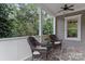 Relaxing front porch with wicker chairs and stone flooring at 235 Grey Rd, Davidson, NC 28036