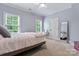 Comfortable bedroom with large windows and plush bedding at 235 Grey Rd, Davidson, NC 28036
