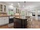 Modern kitchen with a large island, stainless steel appliances, and white cabinetry at 235 Grey Rd, Davidson, NC 28036