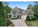 Two-story house with gray siding, attached garage, and landscaped yard at 235 Grey Rd, Davidson, NC 28036