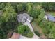 Aerial view of a two-story house with a large backyard and driveway at 235 Grey Rd, Davidson, NC 28036