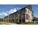 Modern townhouses with brick and dark siding at 2200 N Graham St # 12, Charlotte, NC 28206