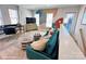 Versatile loft area features a desk, sofa, and artistic wall at 2200 N Graham St # 12, Charlotte, NC 28206