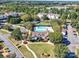 Aerial view of community pool, tennis courts, and clubhouse at 11719 Ridgeway Park Dr, Charlotte, NC 28277