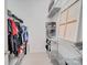 Large walk-in closet with double hanging rods and shelving for storage at 11719 Ridgeway Park Dr, Charlotte, NC 28277