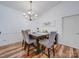Dining room with chandelier and hardwood floors at 11719 Ridgeway Park Dr, Charlotte, NC 28277