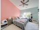 Spacious bedroom with two twin beds, a cat tree, and plenty of natural light at 11719 Ridgeway Park Dr, Charlotte, NC 28277
