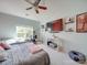 Bright bedroom featuring a large TV, a window with a view, and ample floor space at 11719 Ridgeway Park Dr, Charlotte, NC 28277