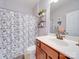 Clean bathroom with a shower/tub combo, vanity with drawers, and a mirror at 11719 Ridgeway Park Dr, Charlotte, NC 28277