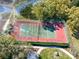 Community tennis court surrounded by trees at 11719 Ridgeway Park Dr, Charlotte, NC 28277